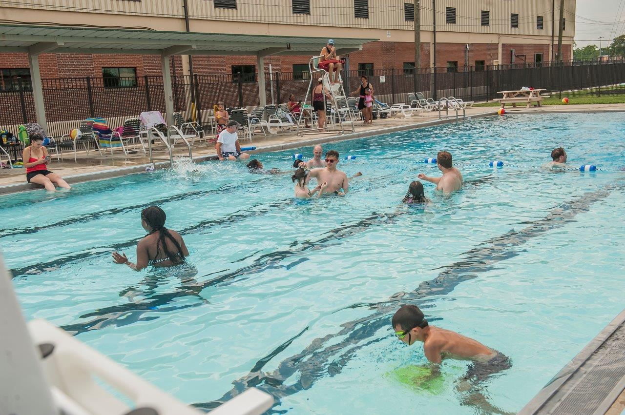 people swimming in a pool people swimming in a pool